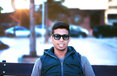 Portrait of smiling young man wearing sunglasses