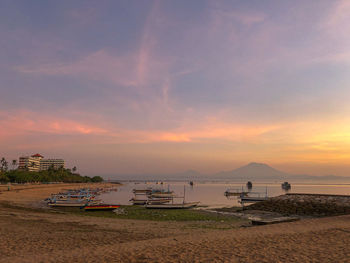 Scenic view of beach against sky during sunset