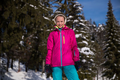 Portrait of girl standing in snow
