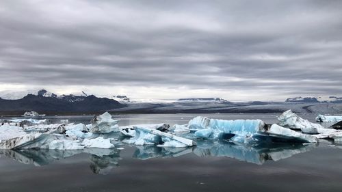 Scenic view of snowcapped landscape against sky during winter