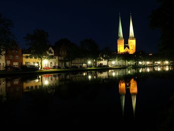 Reflection of illuminated buildings in water