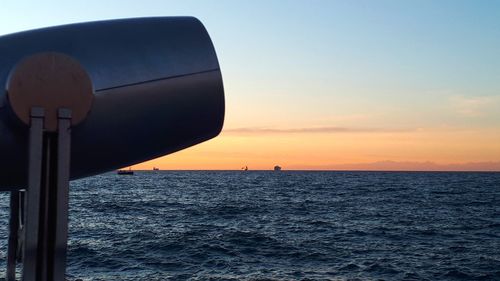 Scenic view of sea against clear sky during sunset