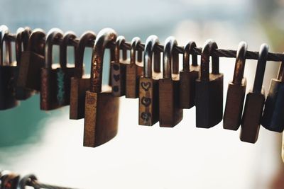 Close-up of padlocks on railing