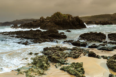 Sea rocks of a beach in cantabria, spain. horizontal image.