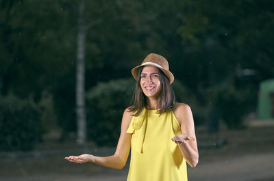 Portrait of smiling woman standing outdoors