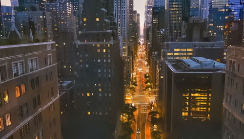 High angle view of illuminated buildings in city at night