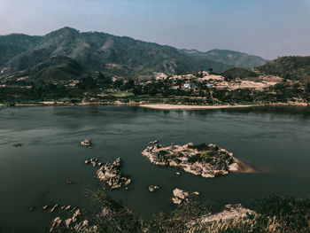 Scenic view of lake and mountains against sky