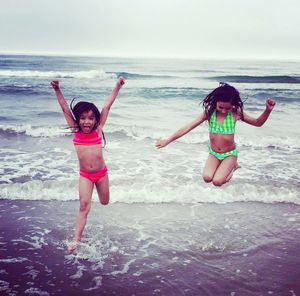 Girl playing in water at beach