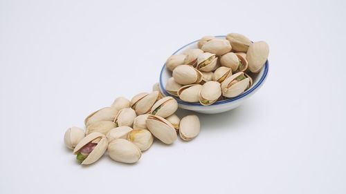 High angle view of eggs in container against white background