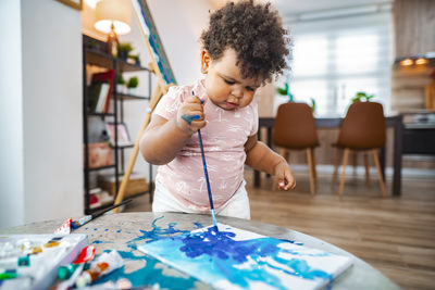 Boy playing with toys at home