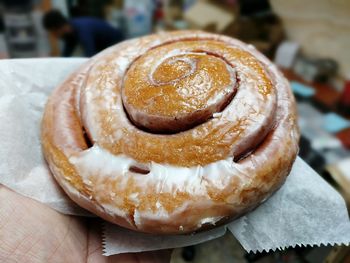 Close-up of hand holding ice cream