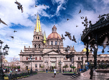 View of buildings in city against sky