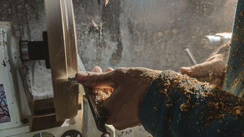 Cropped hands of person working in workshop