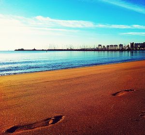 View of beach against blue sky