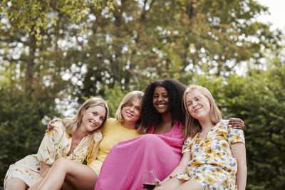 Group of friends resting in forest