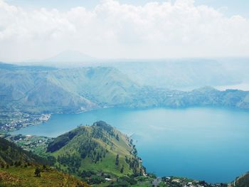 Scenic view of landscape and mountains against sky