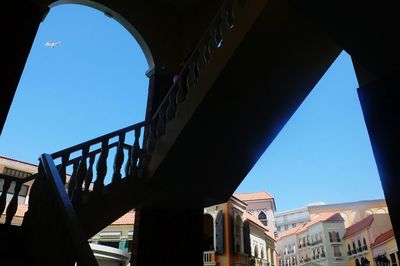 Low angle view of buildings against blue sky