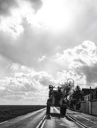 Road against cloudy sky