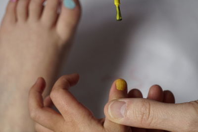 Close-up of hands with painted nails