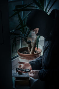 Portrait of woman preparing food at home