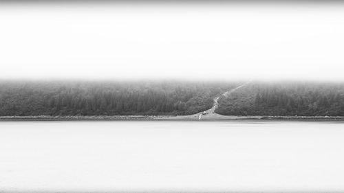 Scenic view of land against sky during winter