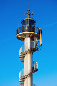 Low angle view of lighthouse against clear blue sky