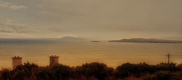 Scenic view of sea against sky at sunset