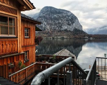 Scenic view of lake by mountain against sky