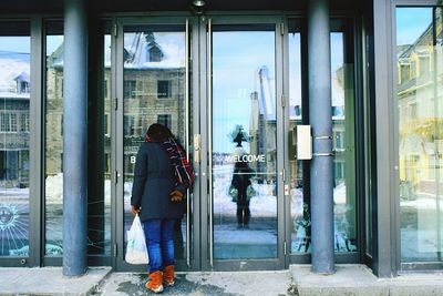 Silhouette of woman standing in city