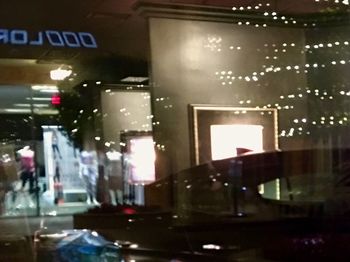 Illuminated city street at night