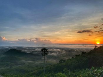 Scenic view of land against sky during sunset