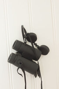 Close-up of camera hanging on cable