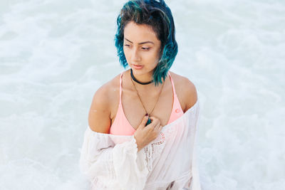 High angle view of young woman in water