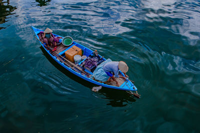 High angle view of man floating on lake