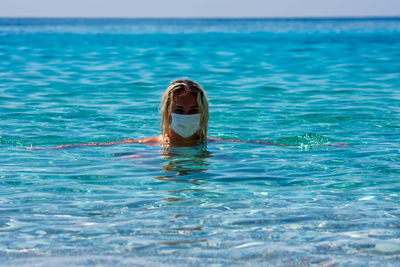 Portrait of person swimming in sea