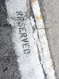 High angle view of text on street during winter