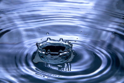 High angle view of drop falling in water