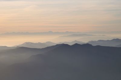 Scenic view of mountains against sky during sunset