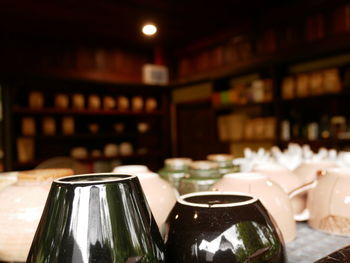 Close-up of wine bottles on table in restaurant