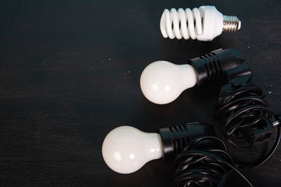 High angle view of illuminated light bulb on table