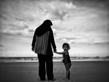 Full length of girl walking on beach