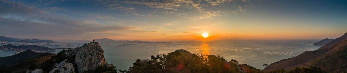 Panoramic view of mountains against sky during sunset