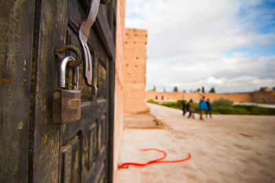 Close-up of padlocks on metal fence