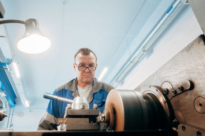 Portrait of man working in factory