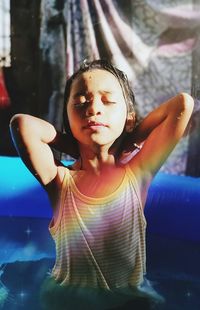 Girl sitting in wadding pool