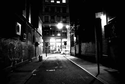 Narrow alley in city at night