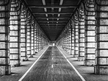 Empty road under bridge