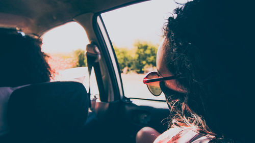 Rear view of woman in car