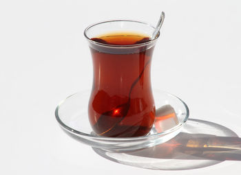 Close-up of tea cup against white background