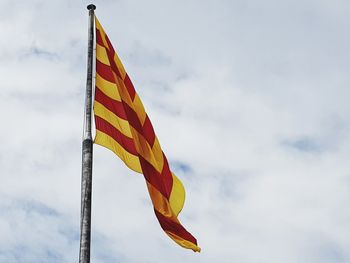 Low angle view of flag against sky